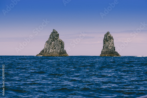 The Friars—four steep dolerite rock islands off the coast of Bruny Island in Tasmania, Australia