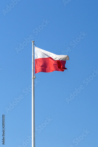 Poland national flag on blue sky background