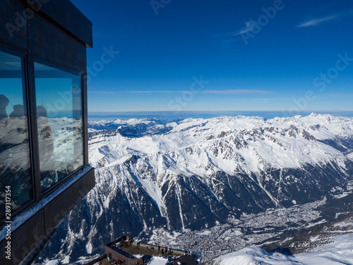France, january 2018: View on Chamonix Valley from top of Aiguille du Midi summit on a sunny winter day