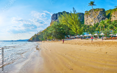 Walk the tideline of Centara Grand Beach, Ao Nang, Krabi, Thailand photo