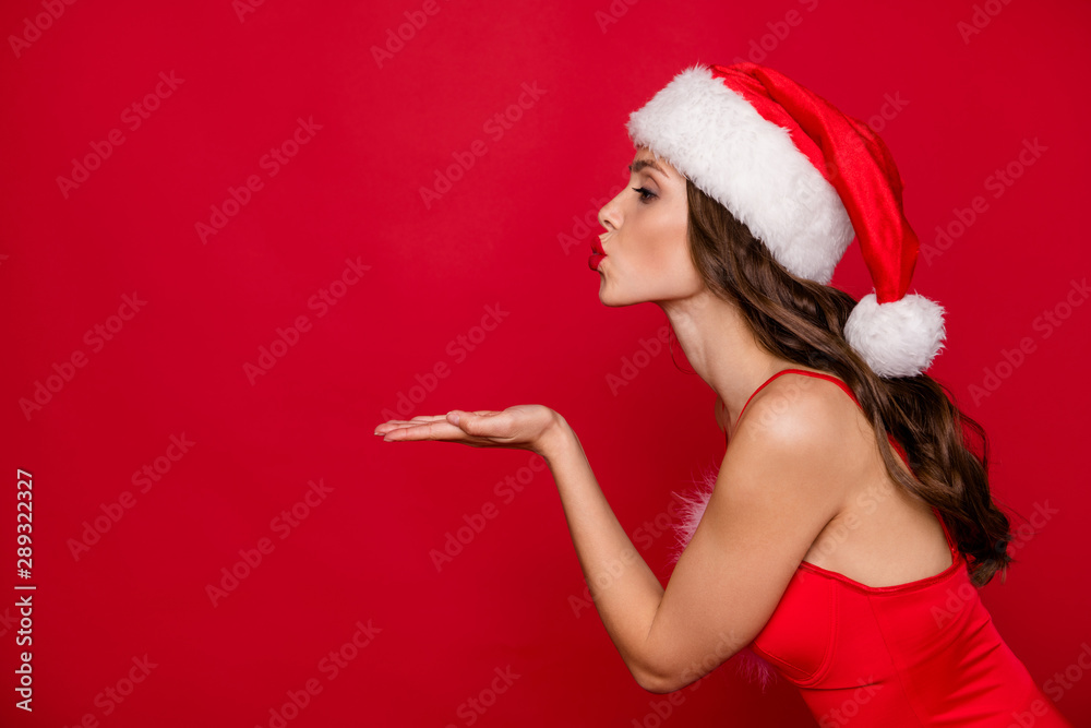 Profile side photo of pretty person with wavy long hairstyle sending air kisses on festive event wearing stylish dress skirt isolated over red background Profile side photo of pretty person with wavy long hairstyle sending air kisses on festive event wearing stylish dress skirt isolated over red background