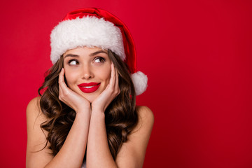 Close up photo of inspired lady looking at copyspace having thoughts about future events wearing cap hat isolated over red background