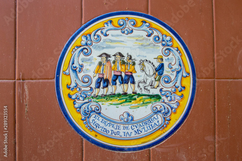 background with a fragment of ceramic tiles in yellow and blue from Talavera de la Reina, in Spain.