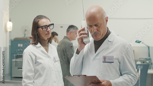 Retro style scientist receiving an important phone call