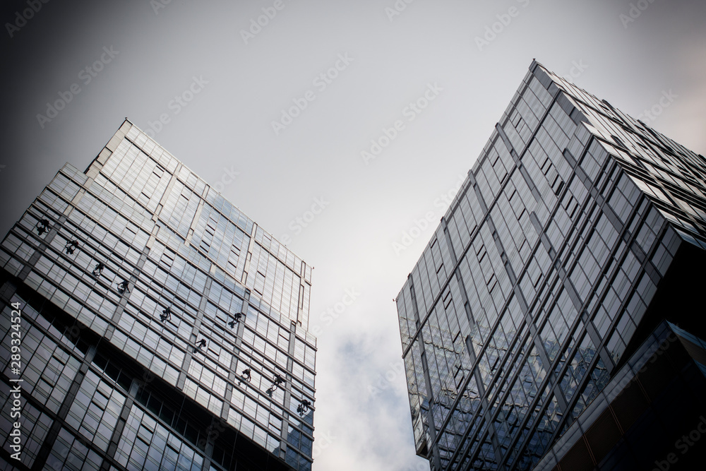 Modern office building with transparent glass Windows. Black and white photo. Ecology of the big city. Modern office building with transparent glass Windows. Black and white photo. Ecology of the big city.