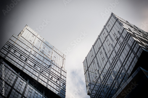 Modern office building with transparent glass Windows. Black and white photo. Ecology of the big city.
