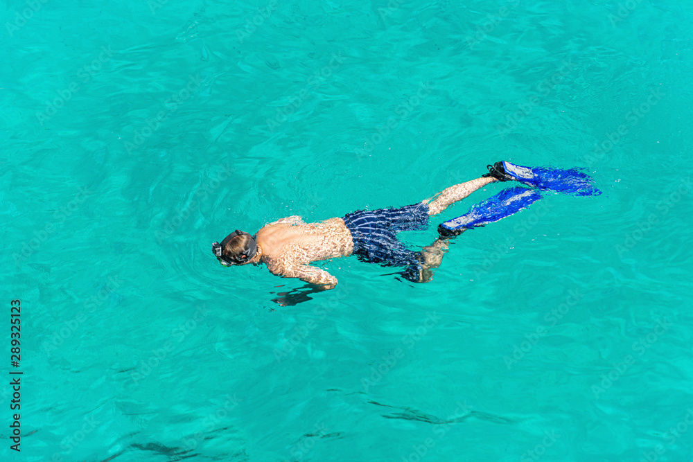 Snorkeler in the turquoise sea