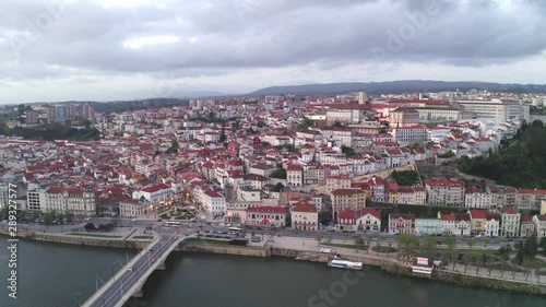 Aerial drone view of Coimbra city and Mondego river at sunset
