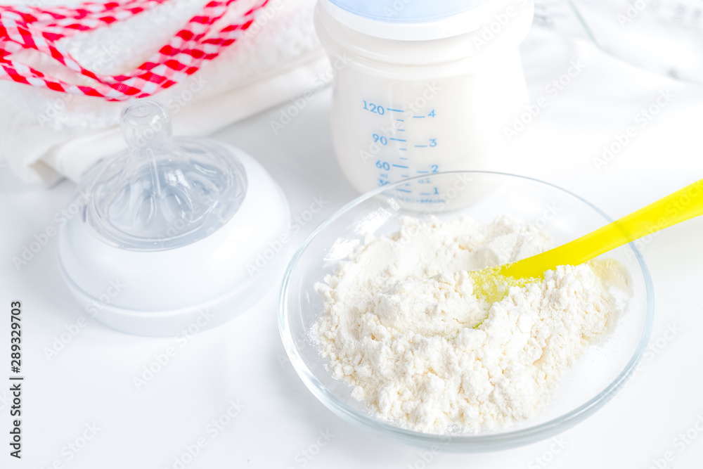 preparation of mixture baby feeding on white background preparation of mixture baby feeding on white background