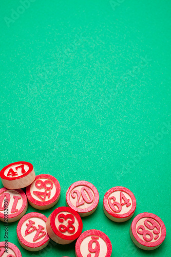 bingo numbers on green background - flat lay style