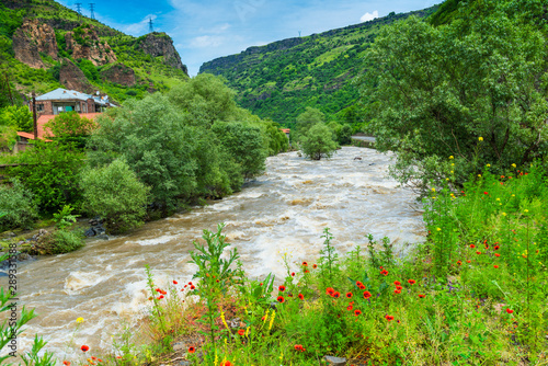 Caucasus, view of a wide and turbulent mountain river photo