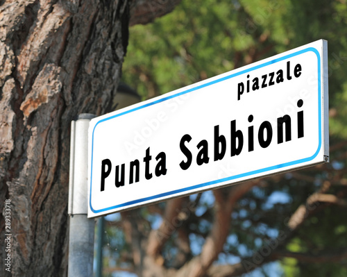 Road Sign with text PUNTA SABBIONI a famous sea place in Norther