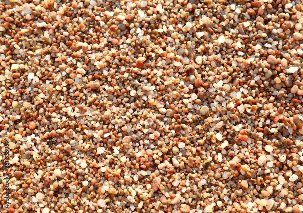 background of many small pebbles in the beach background of many small pebbles in the beach
