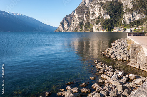 Panorama of Lake Idro from the town of Anfo, with a tourist and fishing port, a tourist destination for holidays at the lake, at the foot of the Alps immersed in unspoilt nature. photo