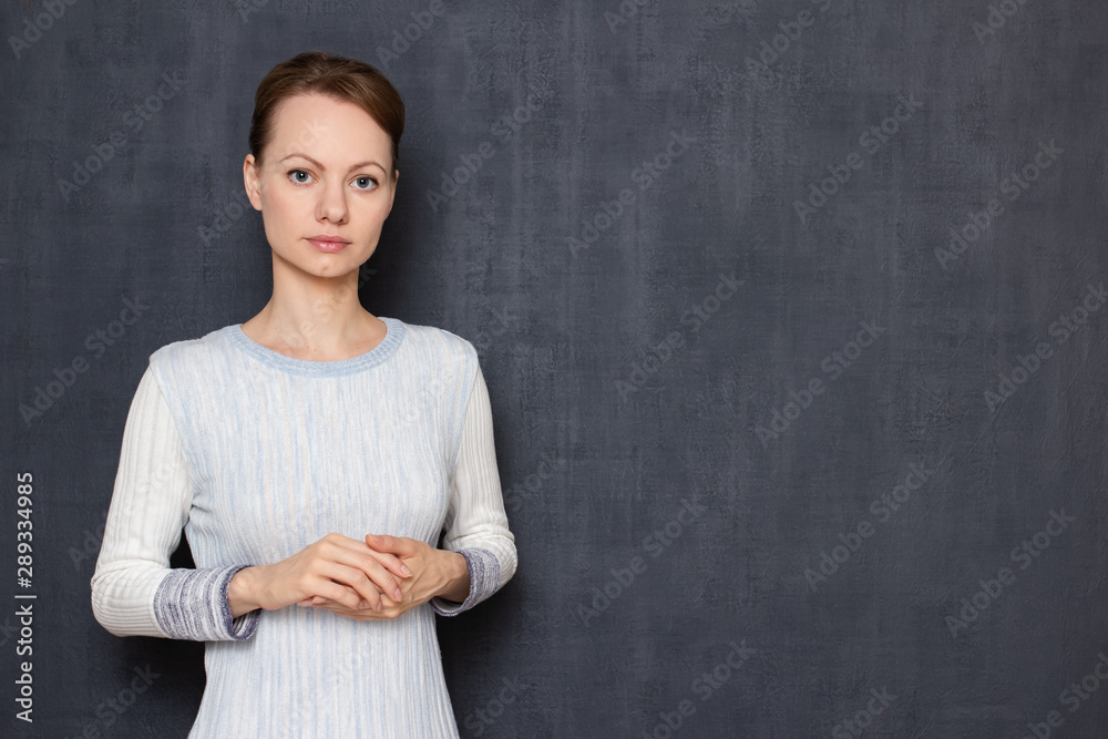 Portrait of calm and focused young woman waiting results Portrait of calm and focused young woman waiting results