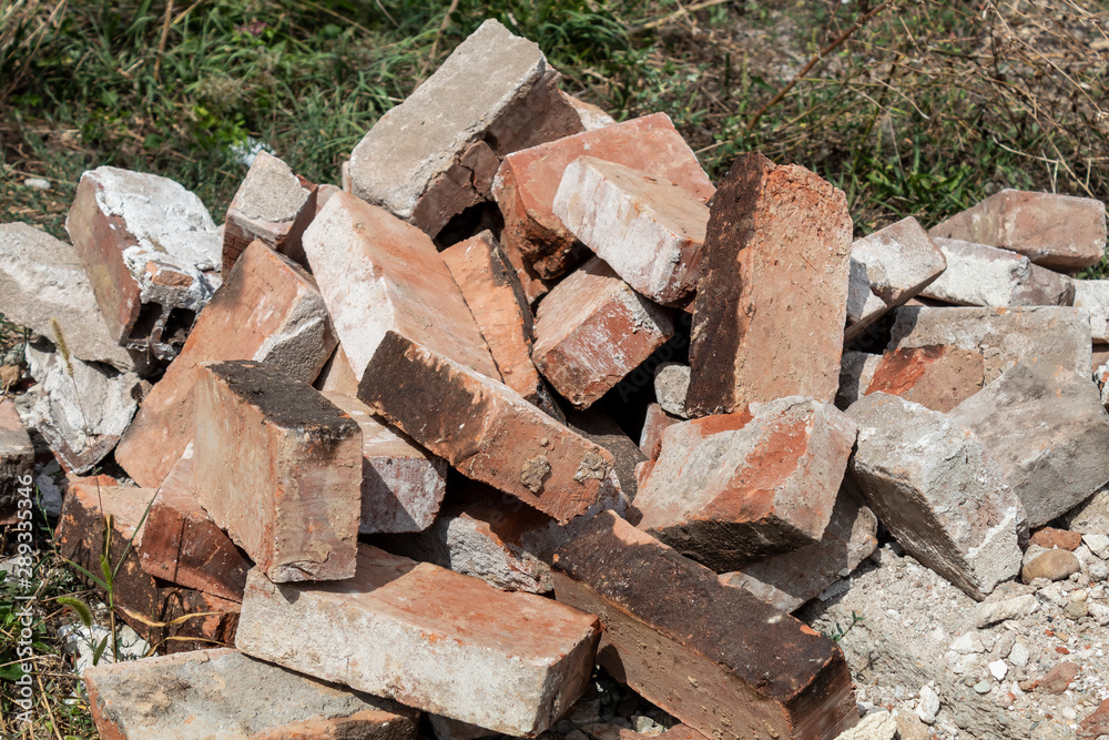 Group of Old Damaged Destroyed Thrown Away Red Bricks
