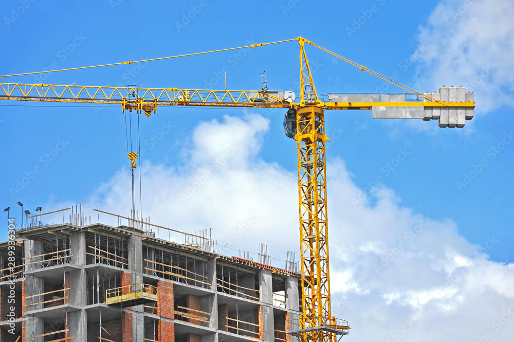 Crane and highrise construction site