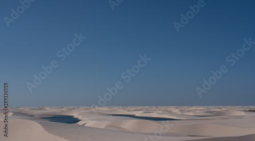 Len  ois Maranhenses oasis lake in desert with sand dunes during sunset