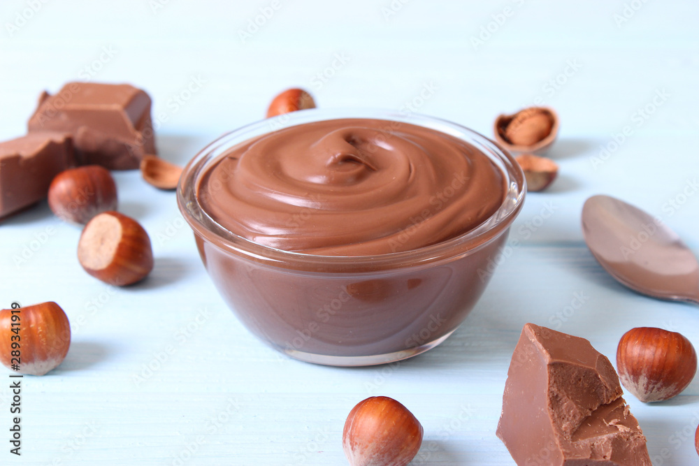 chocolate paste with a bowl on a table. chocolate paste with a bowl on a table.
