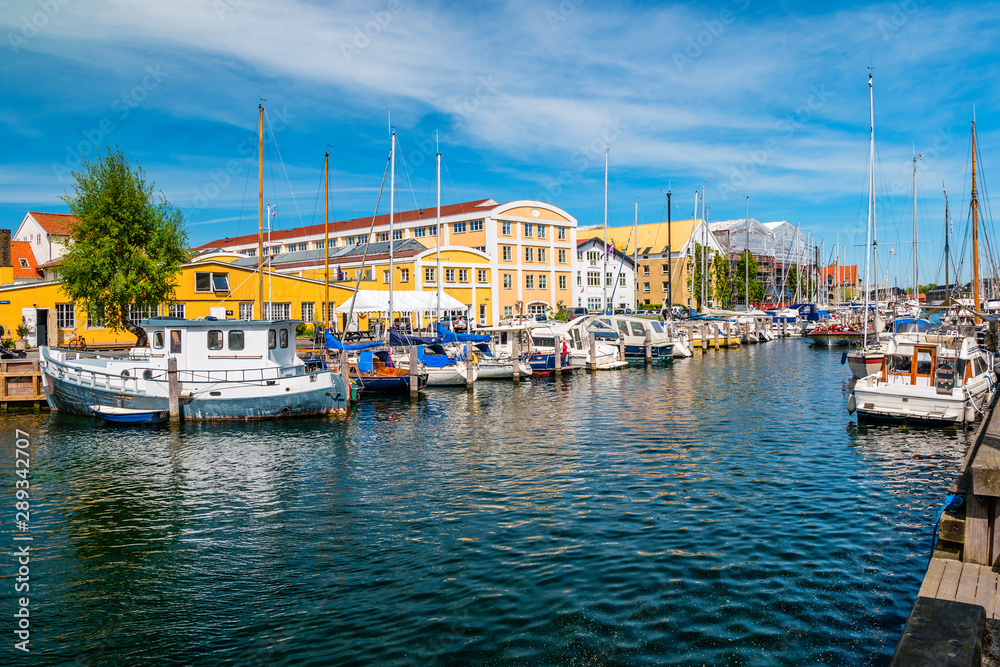 Christianshavn channel with colorful buildings and boats in Copenhagen, Denmark