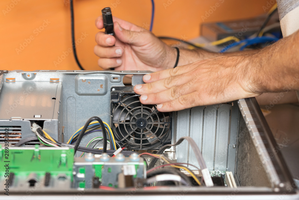 Technician repairing the computer. Concept of computer hardware, repairing, upgrade and technology . Technician repairing the computer. Concept of computer hardware, repairing, upgrade and technology .