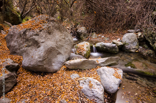 Hiking trail Los Cahorros de Monachil (Granada) in Autumn. Impressive gorge carved by the Monachil River. It is a place of singular beauty with waterfalls, caves and suspension bridges. photo