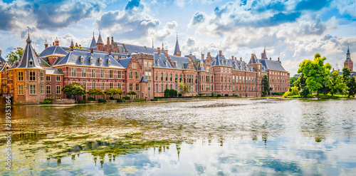 Panoramic landscape view with popular parliament building of the Binnenhof at a beautiful pond , The Hague, The Netherlands.