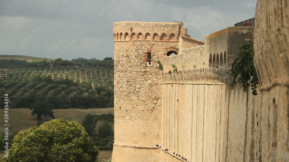Walls of the town of Magliano in Tuscany. Maremma. Landscape wit