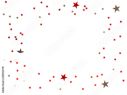 Frame made of scattering stars confetti on white background. Holiday backdrop.