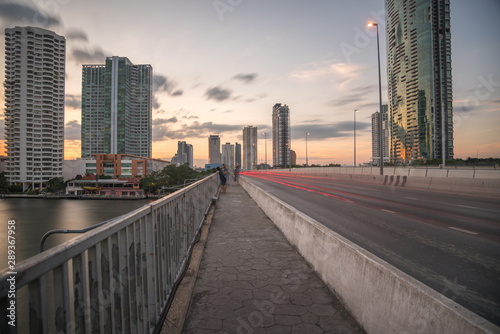 Taksin Bridge Crossing the Chao Phraya River in Bangkok  Thailand at Sunset