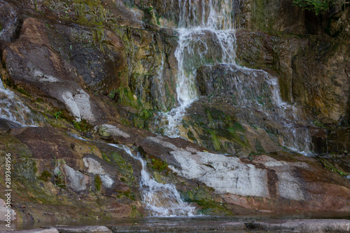 Beautiful nature waterfall on a small lake