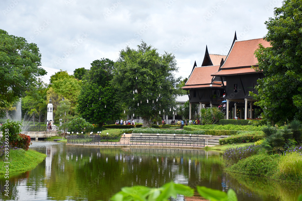Kanchanaburi, Thailand, 09.09.2019: Beautiful garden, lake, traditional Thai, Siamese clothes, buildings of 