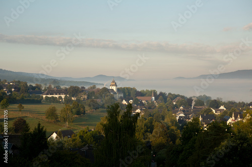 Low hanging morning mist over the mountainous spa village of Grafschaft in the winter sports region of Sauerland, Germany
