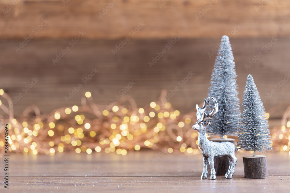 Colorful Christmas tree on wooden, bokeh background. - obrazy, fototapety, plakaty 