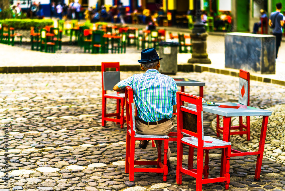 View of local men in the colonial village Jardin in Colombia