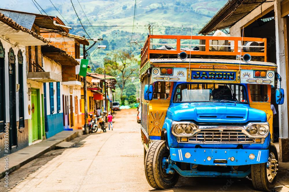 View on Typical colorful chicken bus near Jerico Antioquia, Colombia, South America - obrazy, fototapety, plakaty 