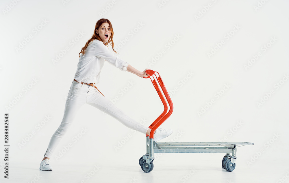 young woman with shopping cart