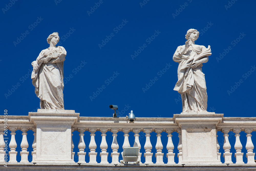 Detail of the statues of saints that crown the colonnades of St. Peter Square built on 1667 on the Vatican City