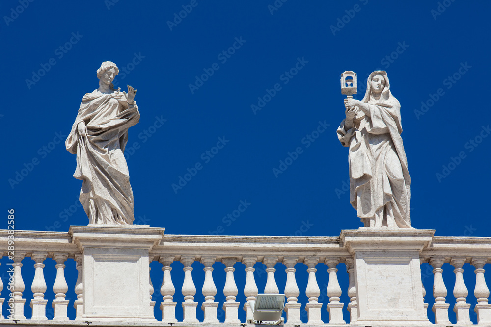 Detail of the statues of saints that crown the colonnades of St. Peter Square built on 1667 on the Vatican City