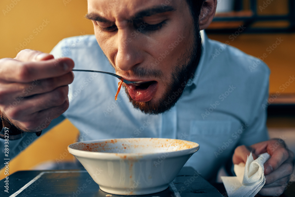 man eating bowl of cereal man eating bowl of cereal