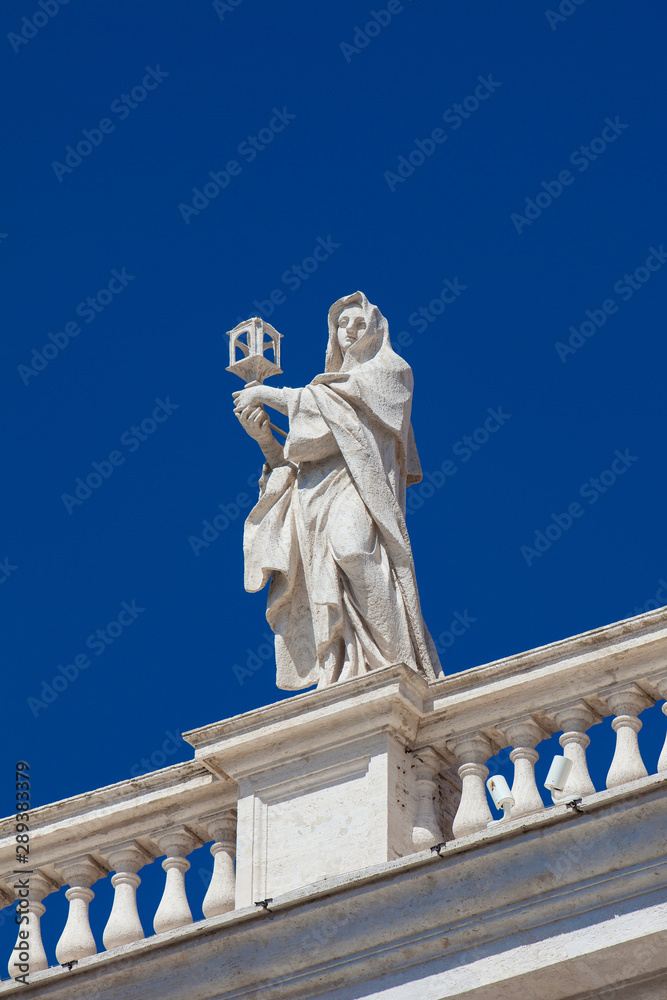 Detail of the statues of saints that crown the colonnades of St. Peter Square built on 1667 on the Vatican City