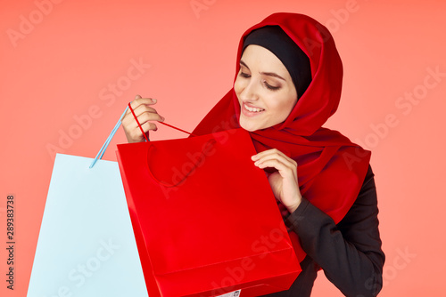 young woman with shopping bags