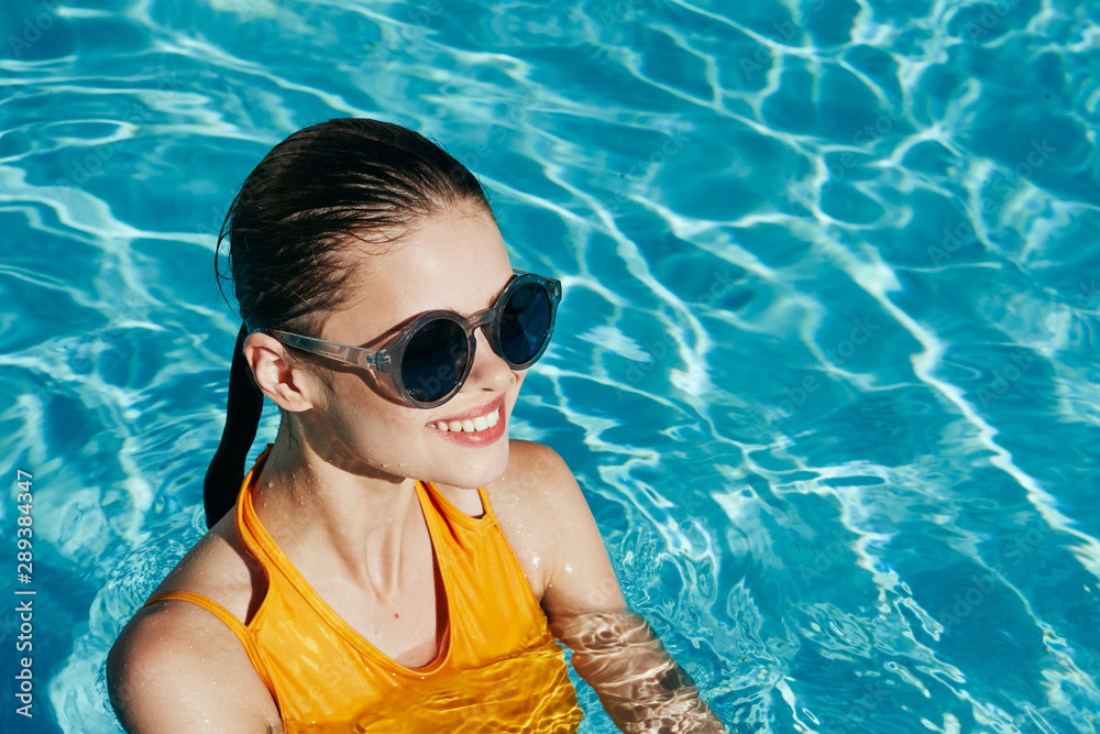 woman in blue goggles in swimming pool