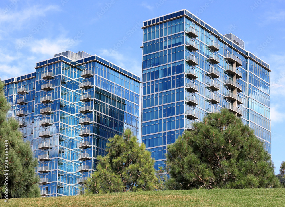 Modern steel and glass buildings with balconies in Denver, Colorado.