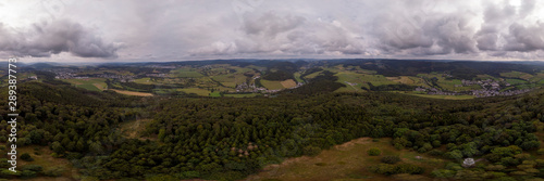 360 degrees panorama from above the pilgrimage catholic mountain of Wilzenberg in the Sauerland region in Germany with the Graftschaft and Schmallenberg villages and agrarian surrounding