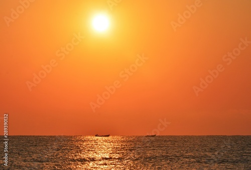 a beautiful sunrise seen from the sea beach