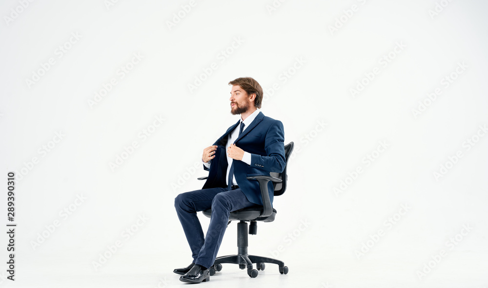 businessman sitting on office chair businessman sitting on office chair