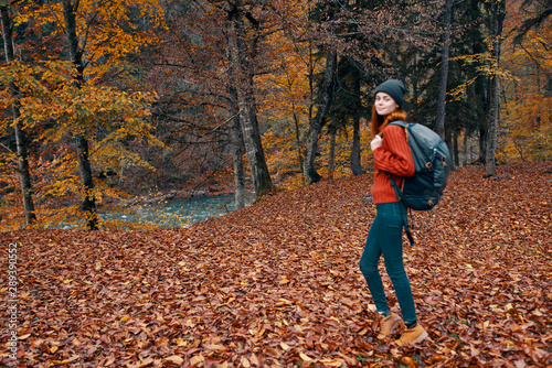 young woman in autumn forest