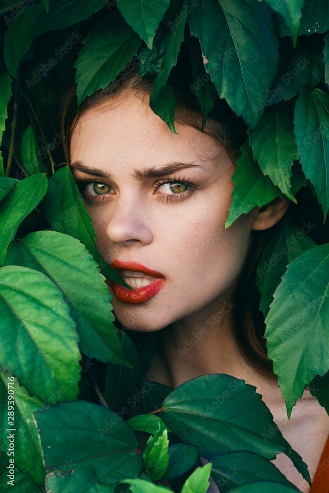 Beautiful woman and green leaves Beautiful woman and green leaves