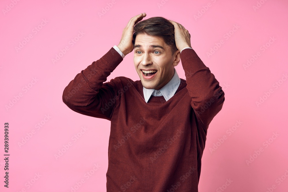 portrait of a man with hands on his head portrait of a man with hands on his head